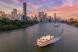 Brisbane city skyline with the river and a ferry in the foreground