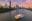 Brisbane city skyline with the river and a ferry in the foreground